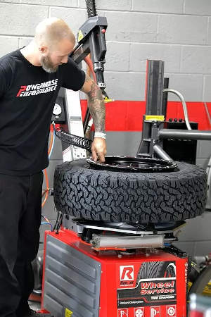 Mechanic with Ranger the Best Tire Changer