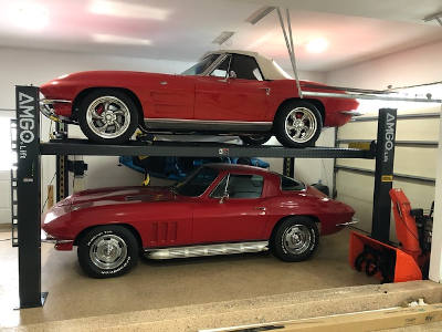 Corvettes on storage parking lift