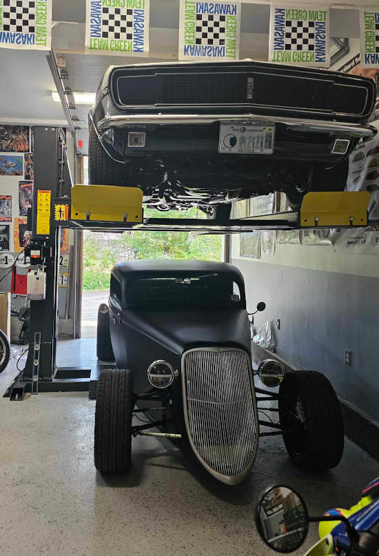 Antique cars stored on the SPL-6 Amgo Hydraulics Single Post Lift Courtesy of Scott M